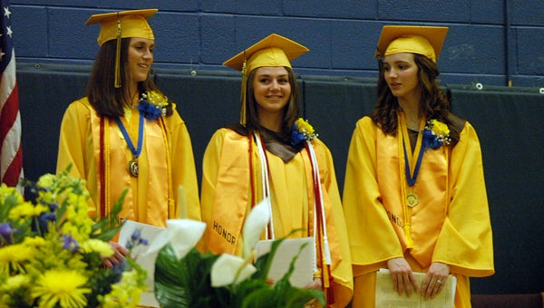 Erica Haimbaugh, Jessica Lafler and Elizabeth Hein stand together after giving speeches during the Niles High School Class of 2013 commencement Thursday at Niles High. Leader photo/CRAIG HAUPERT