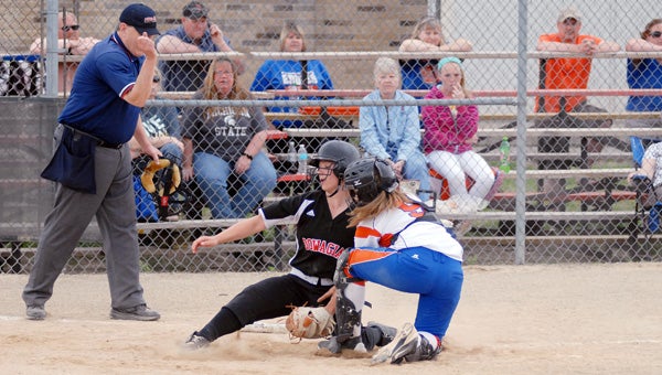 Dowagiac’s Corinne Kasper is tagged out at the plate by Edwardsburg catcher Kaylee Ryker during first-game action Monday afternoon. The Eddies swept the Chieftains 11-1 and 9-6. (Leader photo/SCOTT NOVAK)