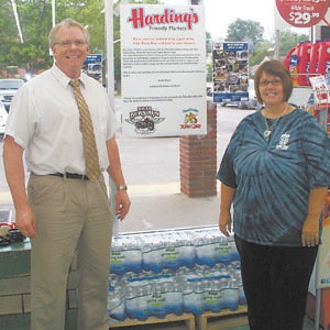 Harding’s Market in Niles donated 10 cases of water to the Niles Burn Run. Pictured are store manager Bill Nichols and Niles Burn Run board member Melinda Michael. Submitted photo