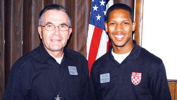Holy Cross College President John Paige and South Ben senior Terron Phillips at Dowagiac Rotary Club June 27.
