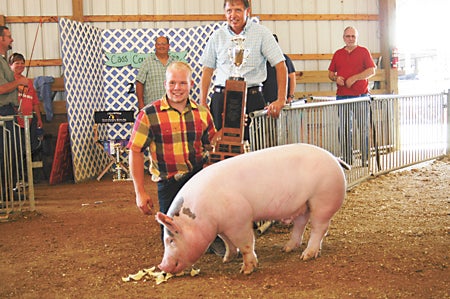 Jeremiah Hartsell of Cassopolis with his grand champion market hog.