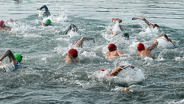 Swimmers take off in the inaugural Diamond Lake Triathlon Saturday. There were 133 finishers in the first event. (Leader photo/SCOTT NOVAK)