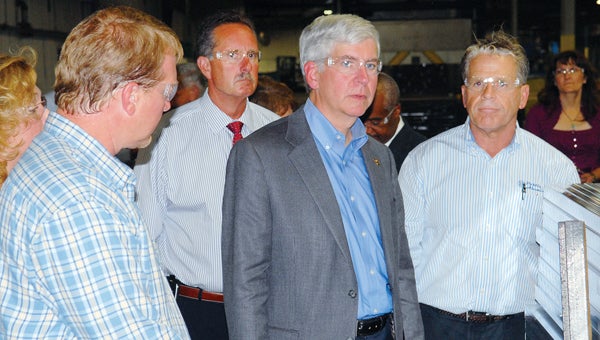Michigan Gov. Rick Snyder tours the Postle Extrusions plant in Cassopolis Monday. Gov. Snyder took part in the official groundbreaking for the $12 million expansion project that is currently under way. (Leader photo/SCOTT NOVAK)