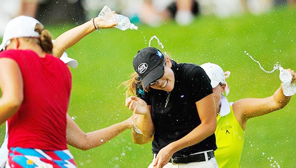 Cydney Clanton gets a shower after winning the 2013 Four Winds Invitational at Blackthorn Golf Club. (Photo courtesy SCOTT MILLER)