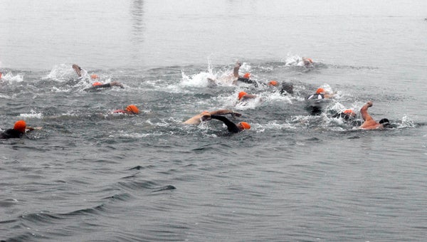 Fog delayed the start of the fourth annual Eagle Lake Triathlon Saturday. The long sprint swim course was shortened by 200 yards due to the dense fog. (Leader photo/SCOTT NOVAK)