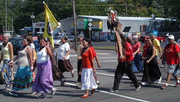 The sixth annual women's water walk crosses North Front Street Friday on Prairie Ronde.
