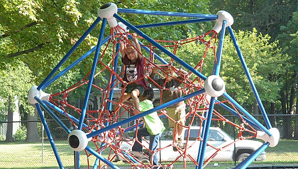Kindergarten students get a chance to check out the playground equipment at Sam Adams Elementary following their orientation tour. (Leader photo/SCOTT NOVAK)