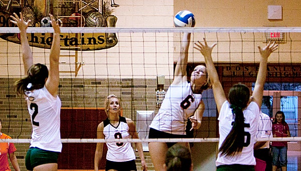 Dowagiac’s Mary Magin (6) goes for a kill against Coloma Thursday night. The Comets swept the Chieftains 3-0 in Wolverine West Division action. (Leader photo/AMELIO RODRIGUEZ)