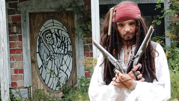Capt. Jack Sparrow, played by actor Dennis Davis, of Niles, welcomes visitors to media night at the Niles Haunted House Scream Park Wednesday. The park opens for business Friday. Leader photo/CRAIG HAUPERT 