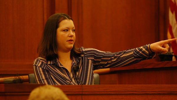 Krista Mehl points out Keith Lintz during trial Tuesday in Cass County Circuit Court. Leader photo/CRAIG HAUPERT