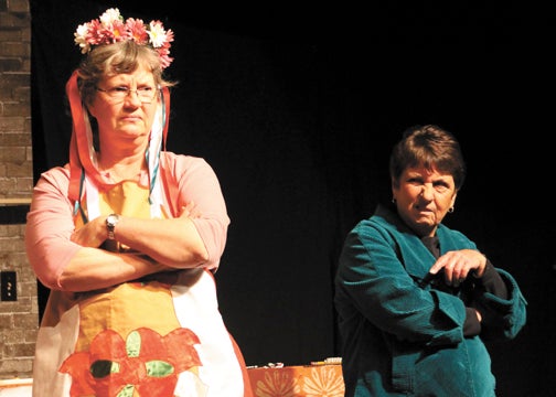 Wendy Elsey as Dottie Biddle (left) and Maryann Bengtsson as Isobel Lomax (right) perform a scene of Caroline Smith’s “Kitchen Witches” during a rehearsal at Beckwith Theatre. Beckwith opens its last performance of the yearat 7:30 p.m. Friday,  with five additional shows following. Leader Photo/AMBROSIA NELDON