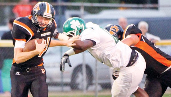 Aaron Adams, left, and the Dowagiac offensive will need to put together some drives against the Edwardsburg defense if the Chieftains want to advance in the Division 4 playoffs. (Leader photo/File)
