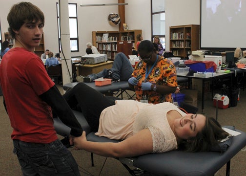 Abby Demeulenare, a sophomore at Brandywine donates blood for the first time at a blood drive at Brandywine High School Wednesday. Leader Photo/AMBROSIA NELDON