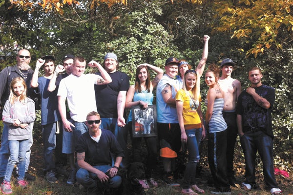 Pictured above are several of Dustin Kuseske’s friends who got tattoos with the “DK” symbol in memory of their friend. Included in the picture are Brent O’Brien, Tyler Dutoi, Paige Taylor, Sarah McCuddy, Scott Trout, Jacob Miller, Joey Gajewski, Derrick Hiler,Matt Weaver, Tervon Williams and Stormie Davis. Not pictured are Keyra Salas and Joe Miller. Leader Photo/AMBROSIA NELDON
