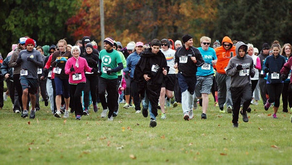 Runners take off at the start of Saturday’s race. Leader photo/CRAIG HAUPERT