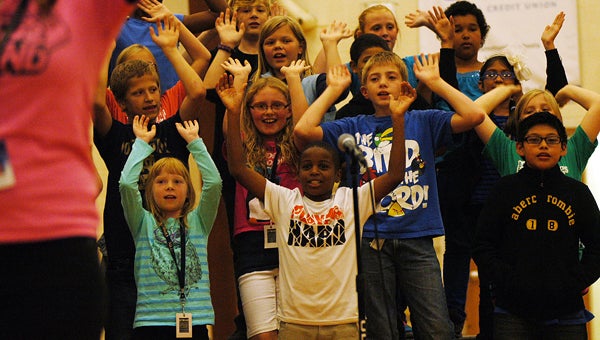 Students sing an encouraging song Monday during a pep rally for the MEAP test, which begins today, at Ballard Elementary. Leader photo/CRAIG HAUPERT