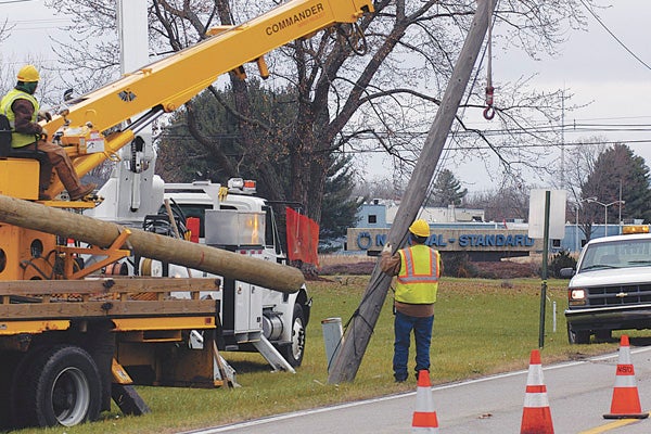 City of Niles electric utility workers prepare to replace a pole leaning over Terminal Road near the intersection of Terminal and Lake streets north of the Jerry Tyler Memorial Airport on Monday. Leader Photo/CRAIG HAUPERT