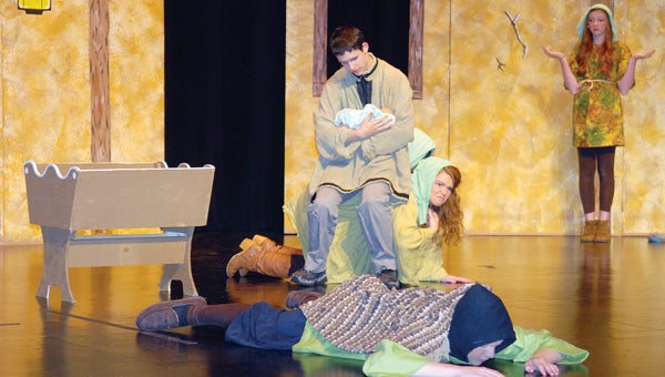 The Miller (Jared Couture) talks to his infant daughter while being unaware of the fair folk that are all around him. Edwardsburg High School is presenting “Rumpelstiltskin” Friday, Saturday and Sunday. (Leader photo/SCOTT NOVAK)