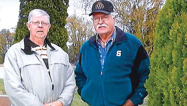 Thomas Green, director of Cass County Veterans Affairs, and Victor Schug have been helping replace headstones for military men who never received them or were in need of repair. (Leader photo/Provided)