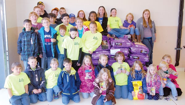 Members of the Legacy 4-H Club delivered more than a ton of food to the Cass County Animal Shelter Saturday afternoon. It was the second year the group had donated food to the shelter. (Leader photo/SCOTT NOVAK)