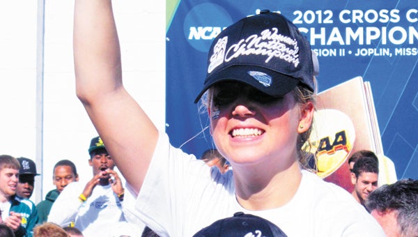 Madie Rodts (top) celebrates the 2012 national championship. (Leader photo/File)