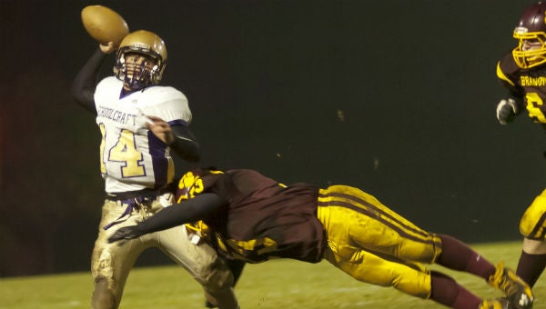 Brandywine's Brandon Earles tries to bring down the Schoolcraft quarterback Friday night. (Leader photo/JOSEPH WEISER)